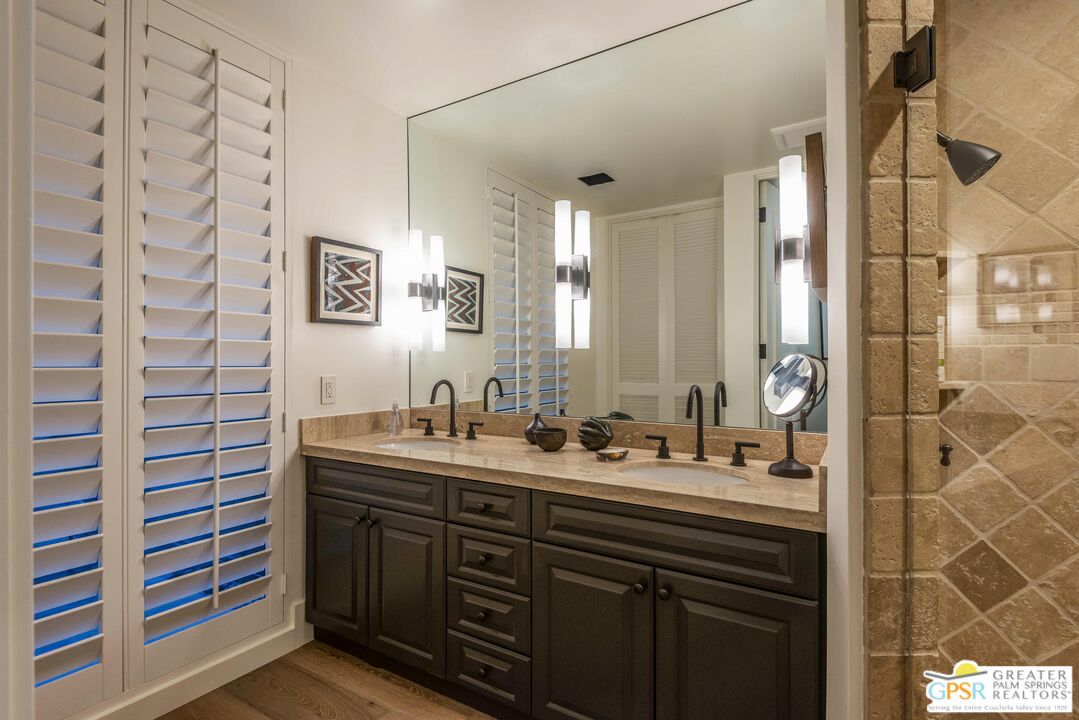 8 Surrey Court Rancho Mirage, CA 92270 - Photo 34 of 48 a bathroom with a double vanity sink mirror and double