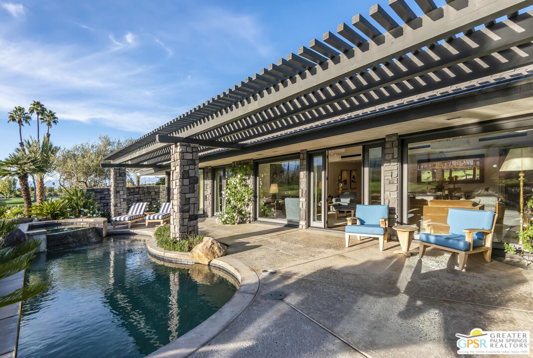 8 Surrey Court Rancho Mirage, CA 92270 - Photo 40 of 48 a building outdoor space with patio furniture and potted plants