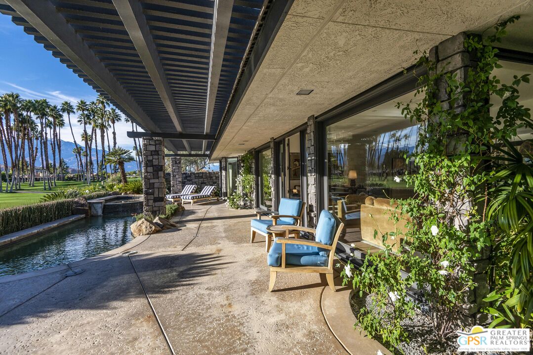 8 Surrey Court Rancho Mirage, CA 92270 - Photo 43 of 48 a view of a chairs and tables in patio with a barbeque