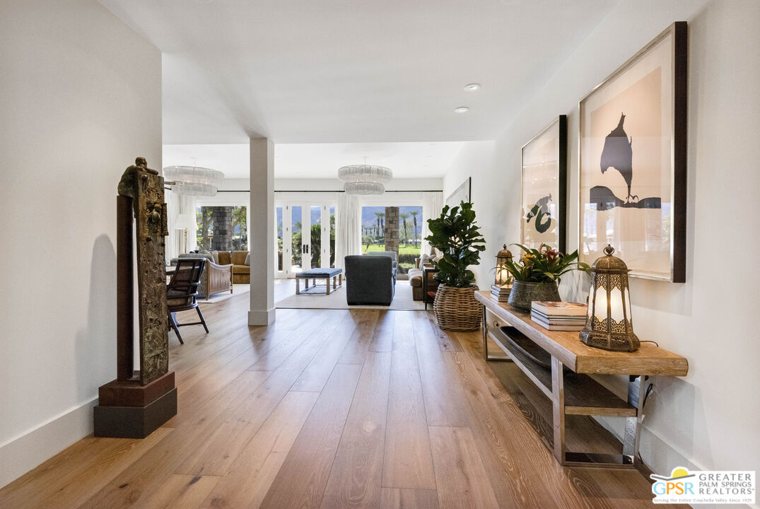 8 Surrey Court Rancho Mirage, CA 92270 - Photo 9 of 48 a living room with furniture and wooden floor