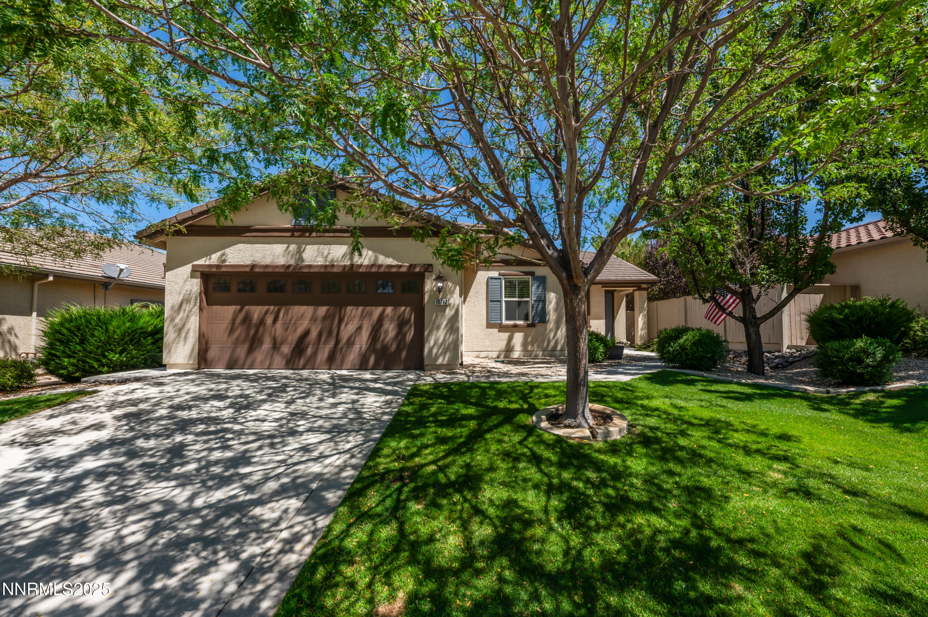 10742 Amber Falls Drive Reno, NV 89521 - Photo 1 of 28 a front view of a house with a yard