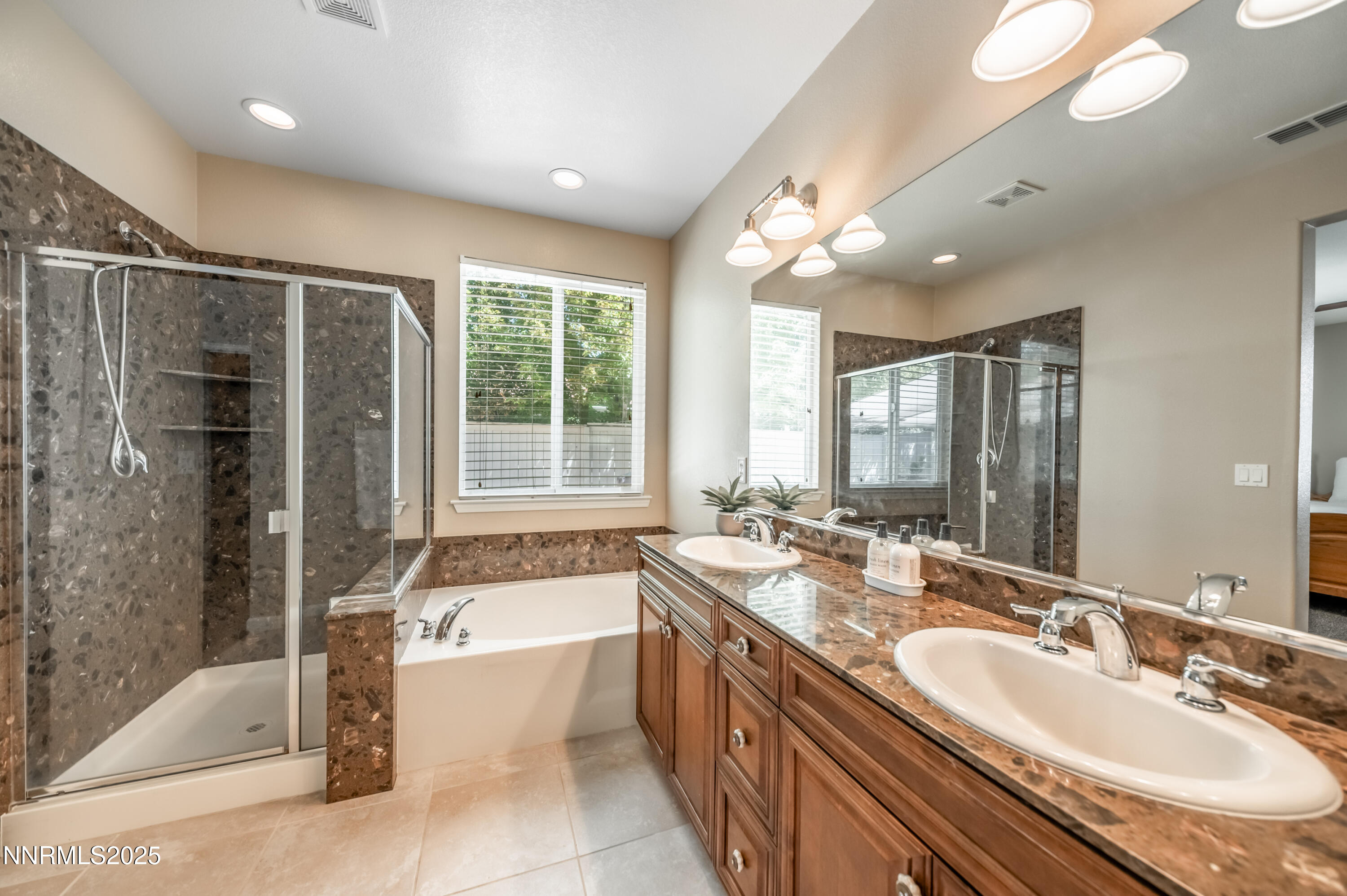 10742 Amber Falls Drive Reno, NV 89521 - Photo 15 of 28 a large spacious bathroom with a large tub shower and sink
