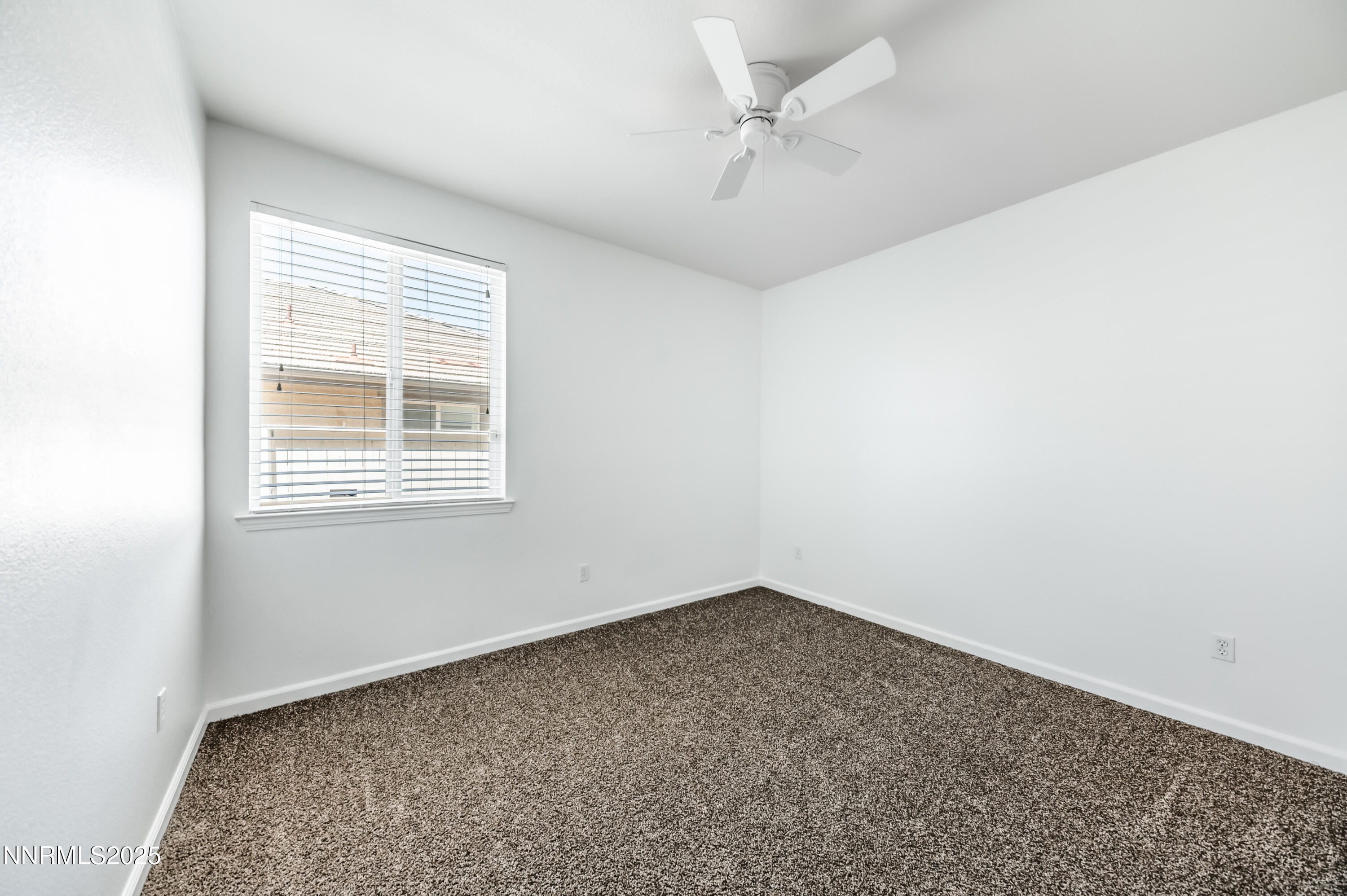10742 Amber Falls Drive Reno, NV 89521 - Photo 22 of 28 a view of an empty room with a window