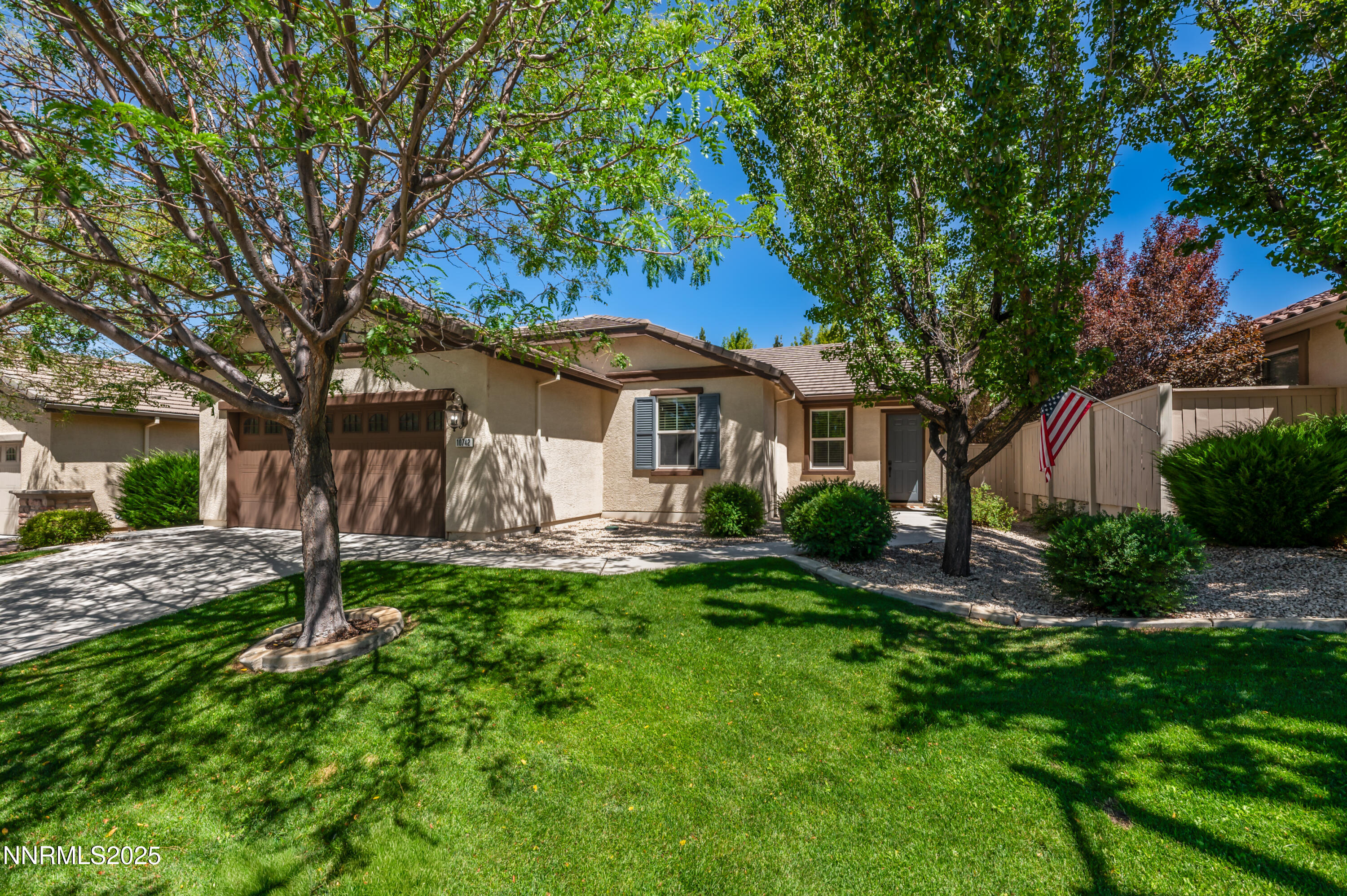 10742 Amber Falls Drive Reno, NV 89521 - Photo 3 of 28 a view of a house with backyard and a tree