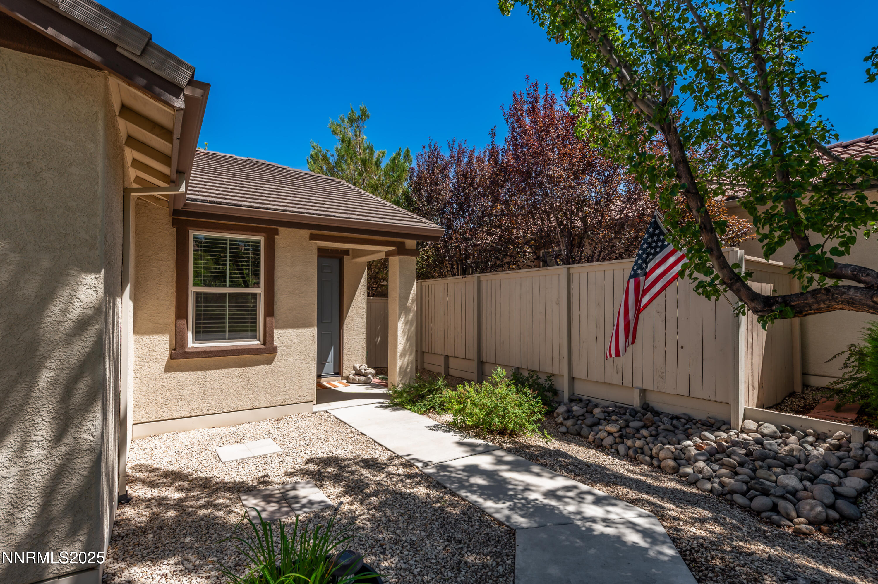 10742 Amber Falls Drive Reno, NV 89521 - Photo 4 of 28 a front view of a house with garden