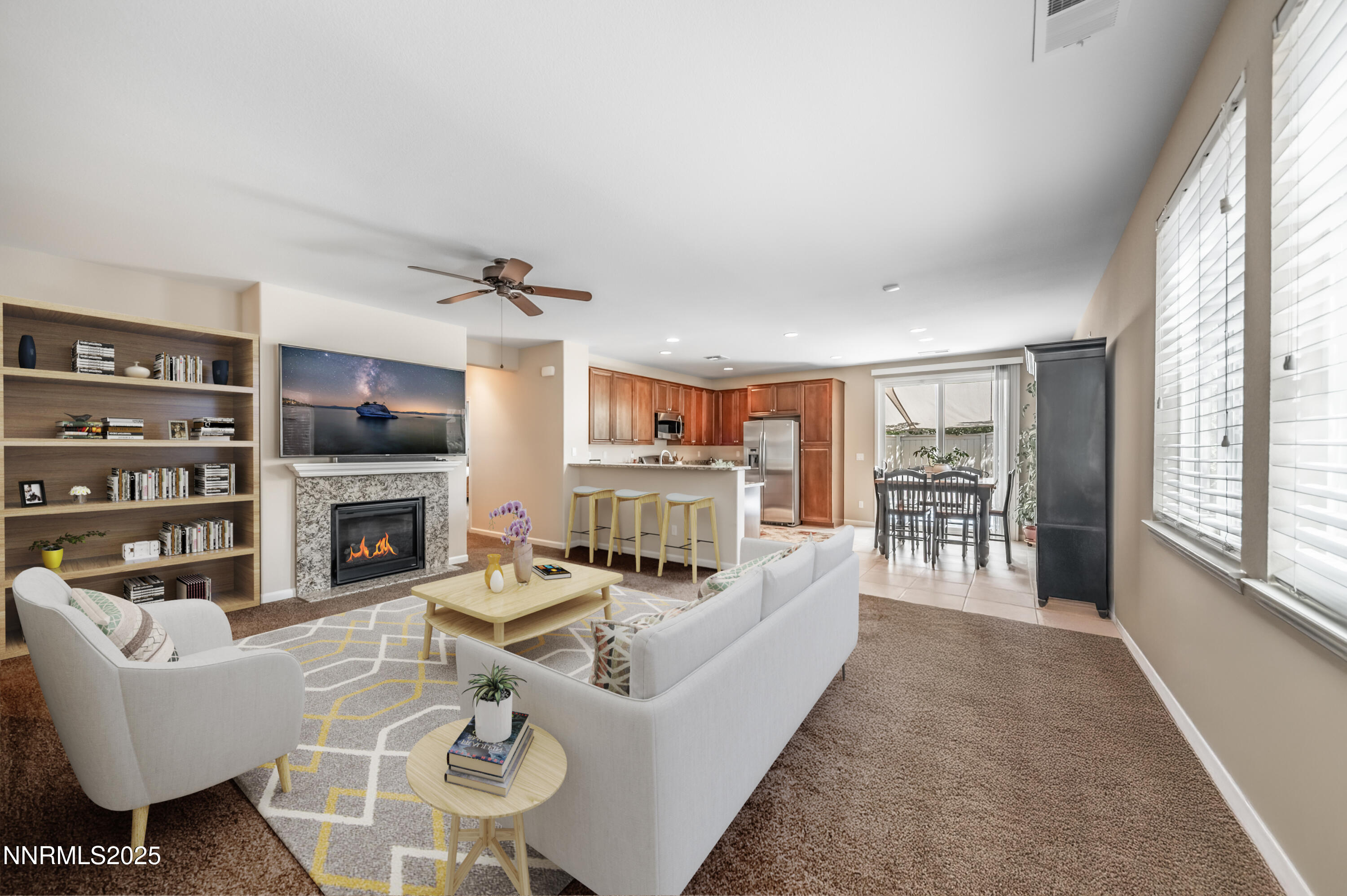 10742 Amber Falls Drive Reno, NV 89521 - Photo 5 of 28 a living room with furniture a fireplace and a large window