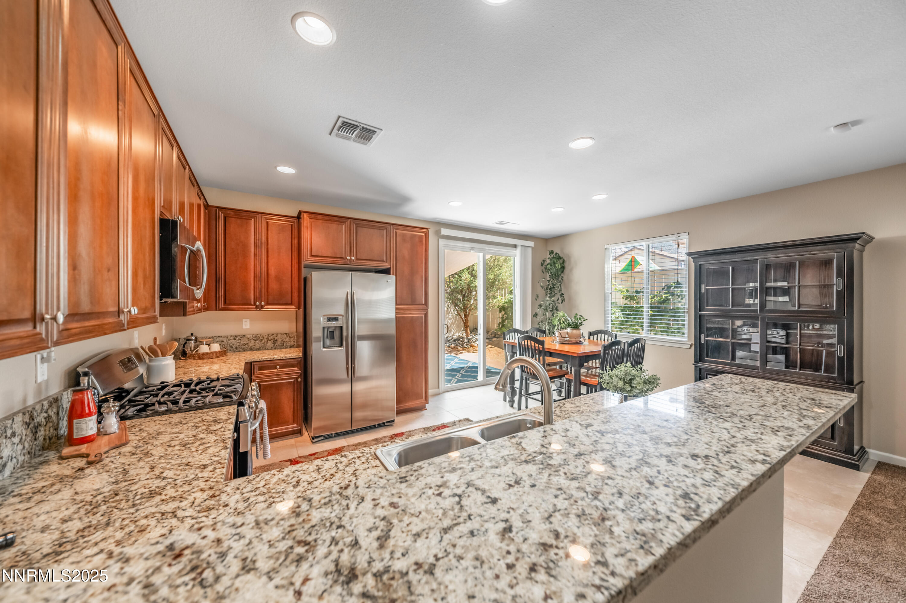 10742 Amber Falls Drive Reno, NV 89521 - Photo 10 of 28 a living room with large windows and furniture