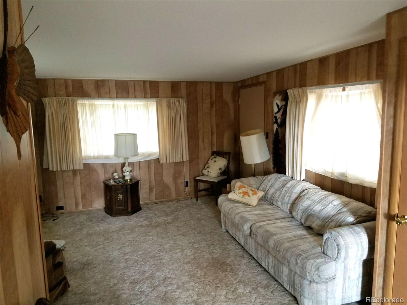 165 Baker Road Bailey, CO 80421 - Photo 16 of 20 a living room with furniture and a large window