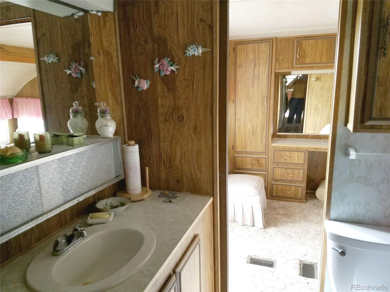 165 Baker Road Bailey, CO 80421 - Photo 9 of 20 a bathroom with a sink and a mirror
