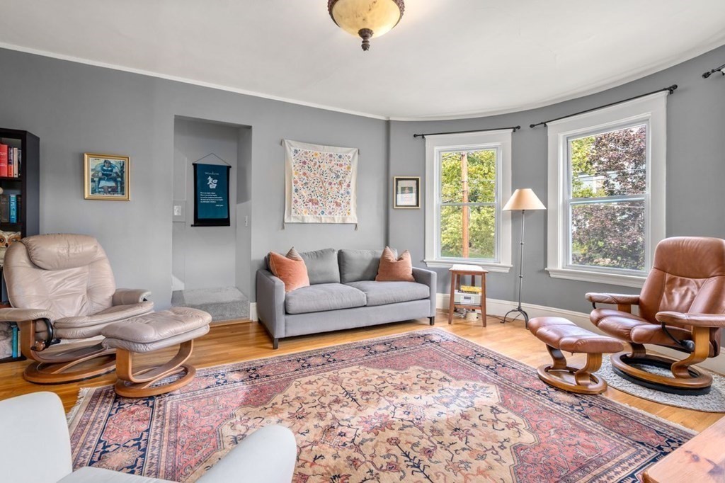 51 Franklin Street, Unit 51 Watertown, MA 02472 - Photo 3 of 15 a living room with furniture a rug and a large window
