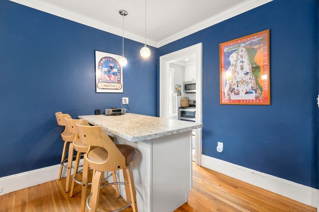 51 Franklin Street, Unit 51 Watertown, MA 02472 - Photo 6 of 15 a dining room with a table and chairs