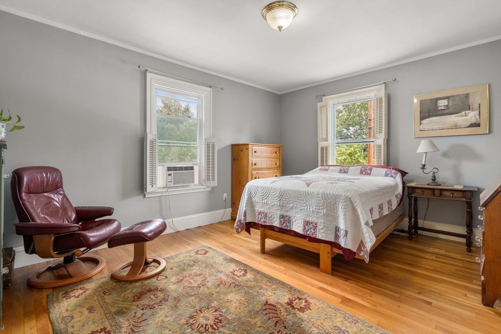 51 Franklin Street, Unit 51 Watertown, MA 02472 - Photo 9 of 15 a bedroom with a bed chair and a window