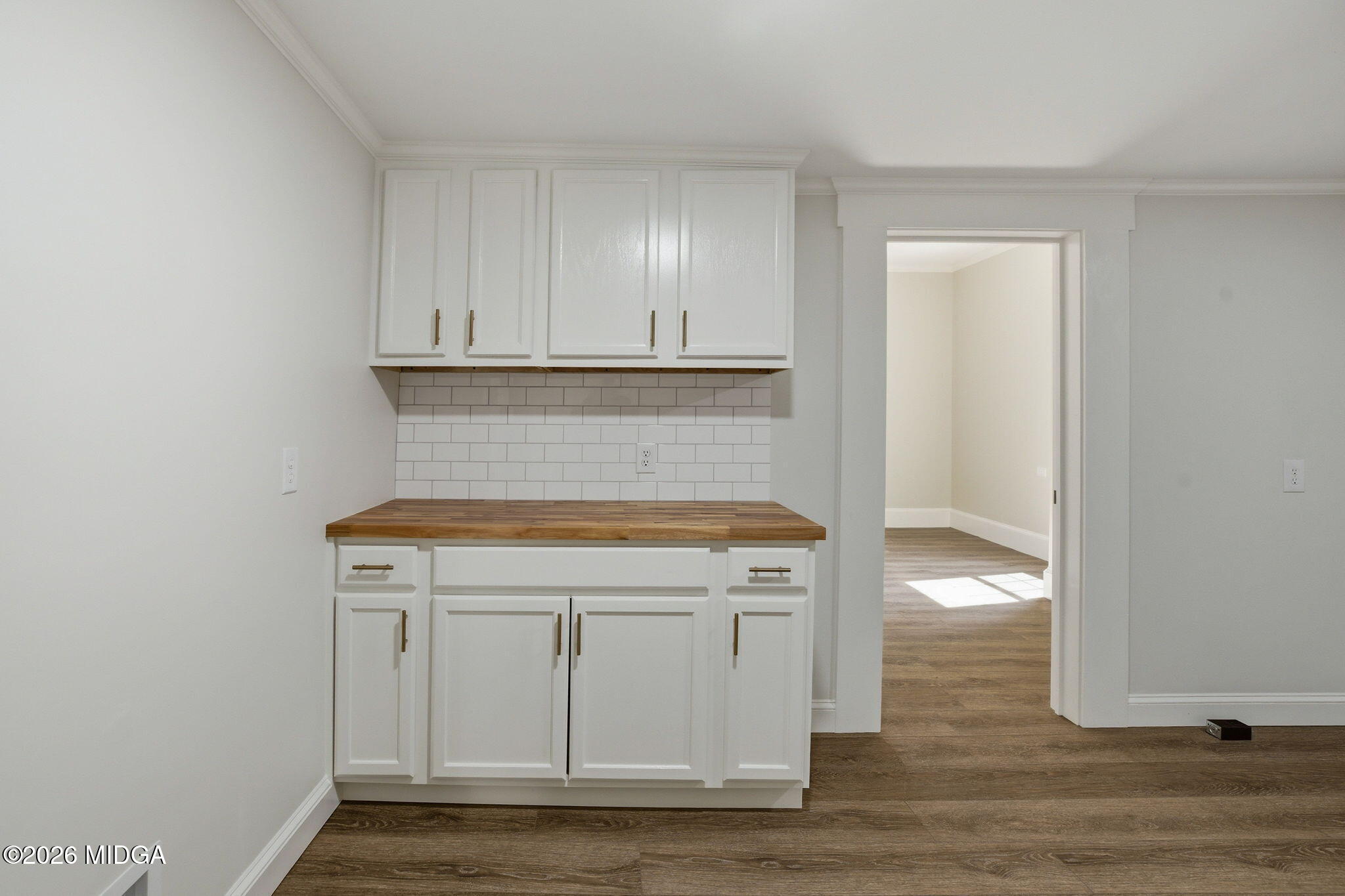 3181 Dames Ferry Road Forsyth, GA 31029 - Photo 18 of 36 a kitchen with granite countertop cabinets and sink
