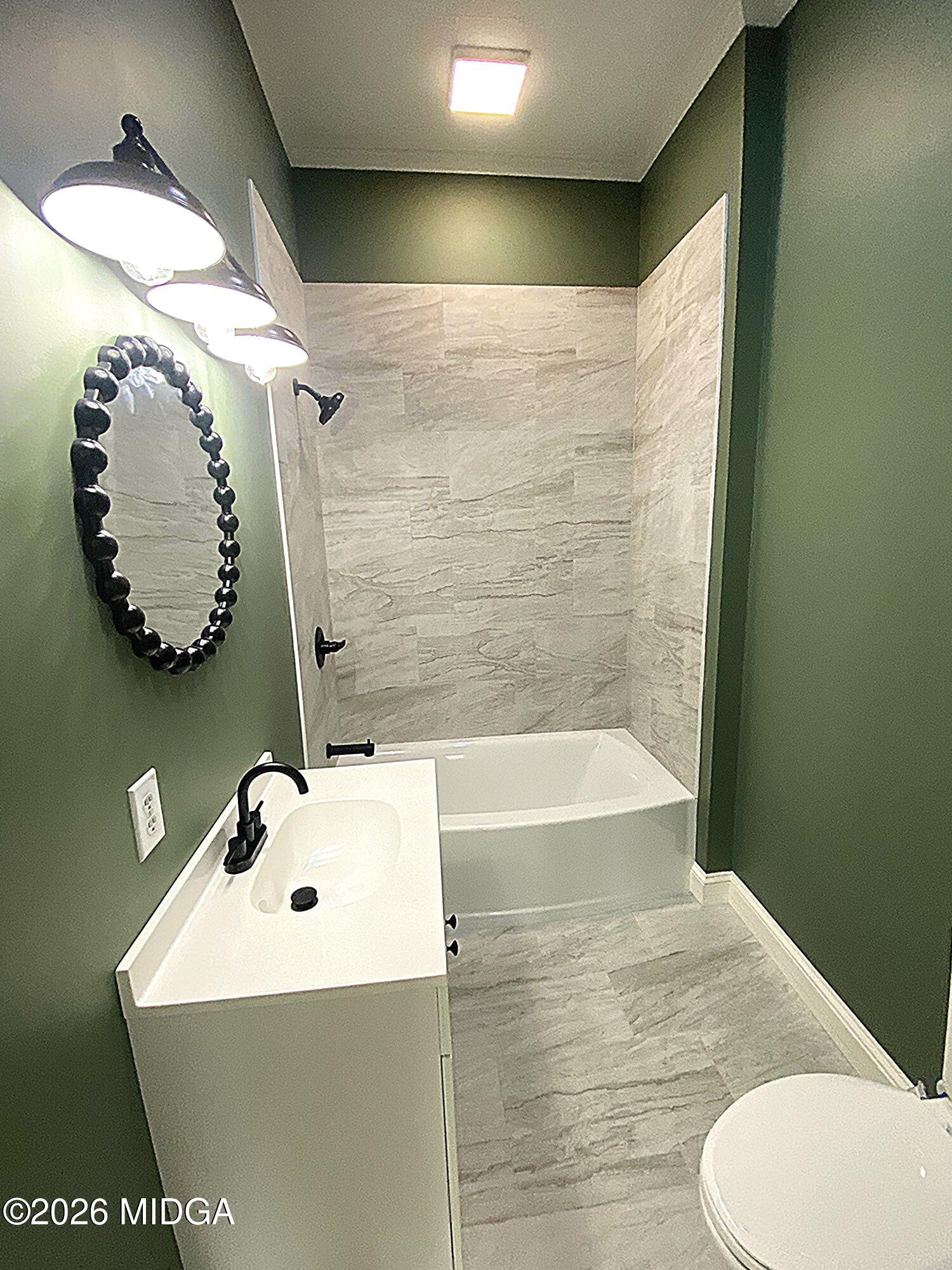 3181 Dames Ferry Road Forsyth, GA 31029 - Photo 22 of 36 a bathroom with a sink and mirror