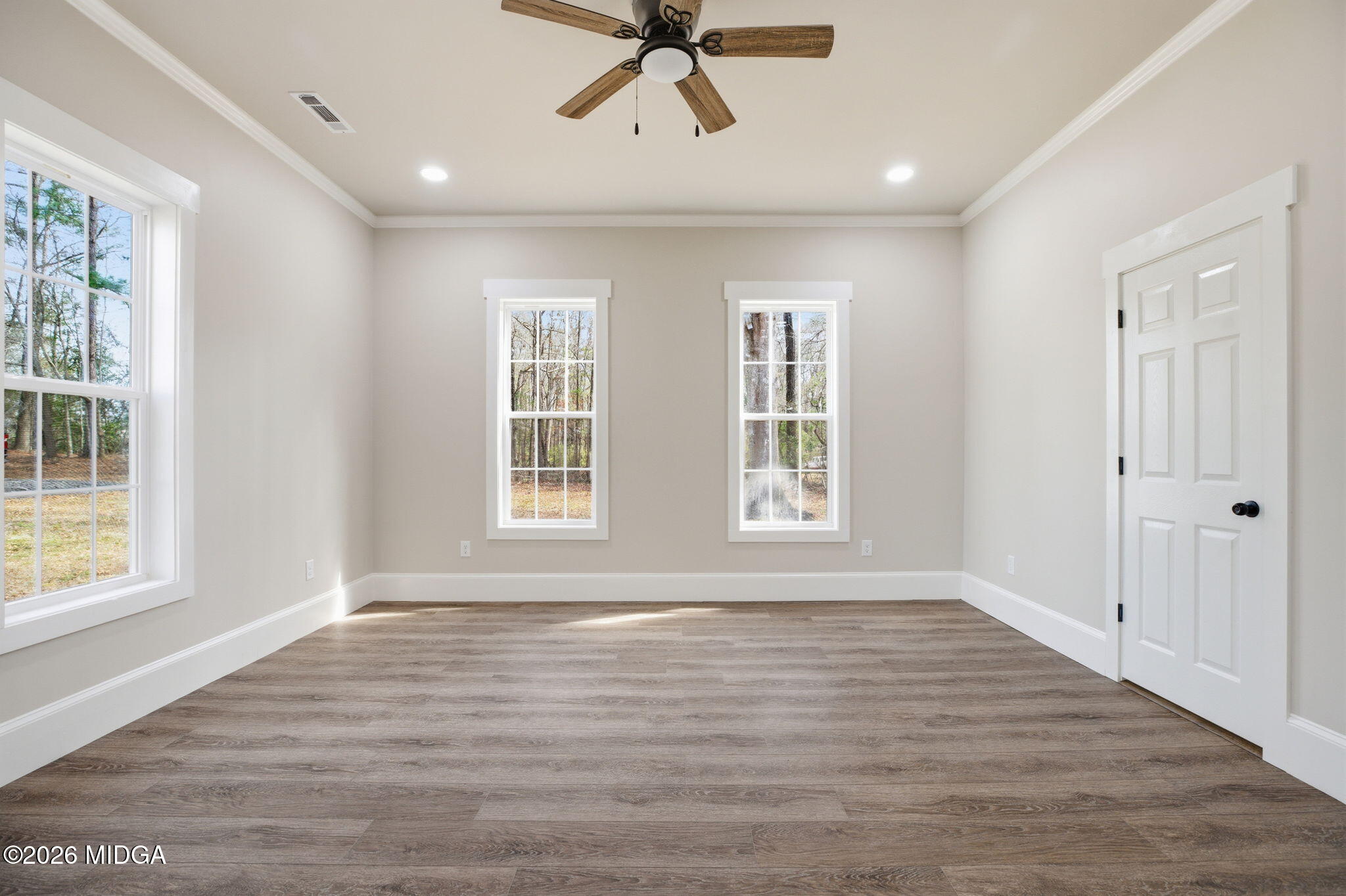 3181 Dames Ferry Road Forsyth, GA 31029 - Photo 24 of 36 wooden floor in an empty room with a window