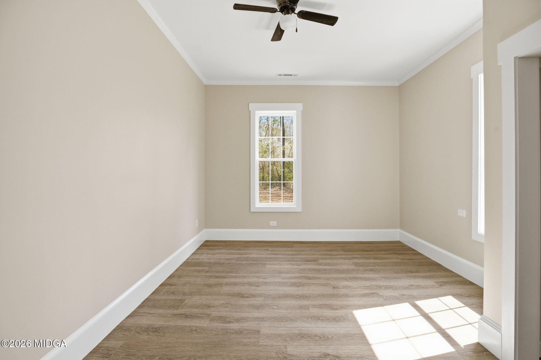 3181 Dames Ferry Road Forsyth, GA 31029 - Photo 33 of 36 wooden floor in a empty room with a window