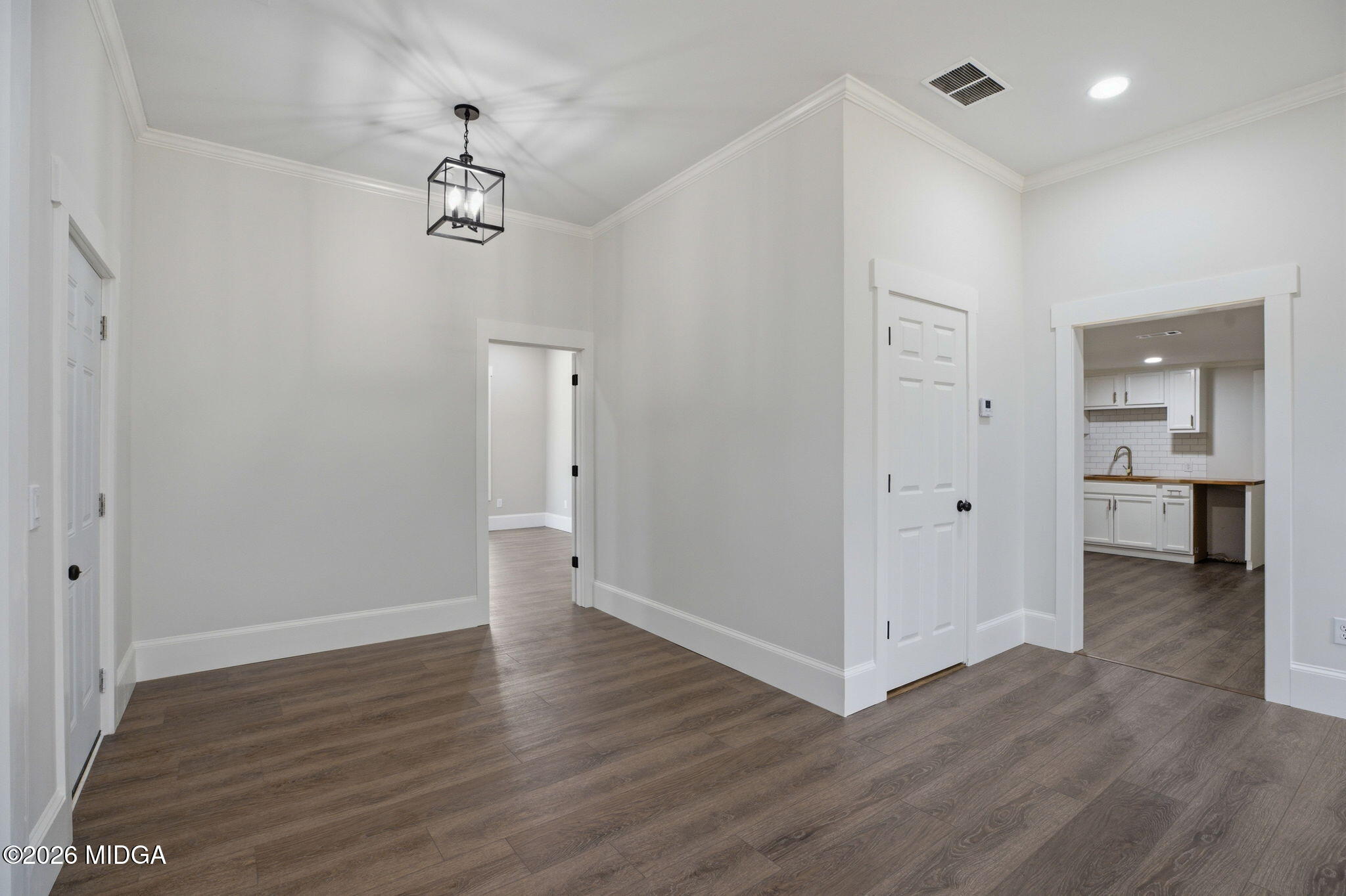 3181 Dames Ferry Road Forsyth, GA 31029 - Photo 9 of 36 wooden floor in an empty room with a window