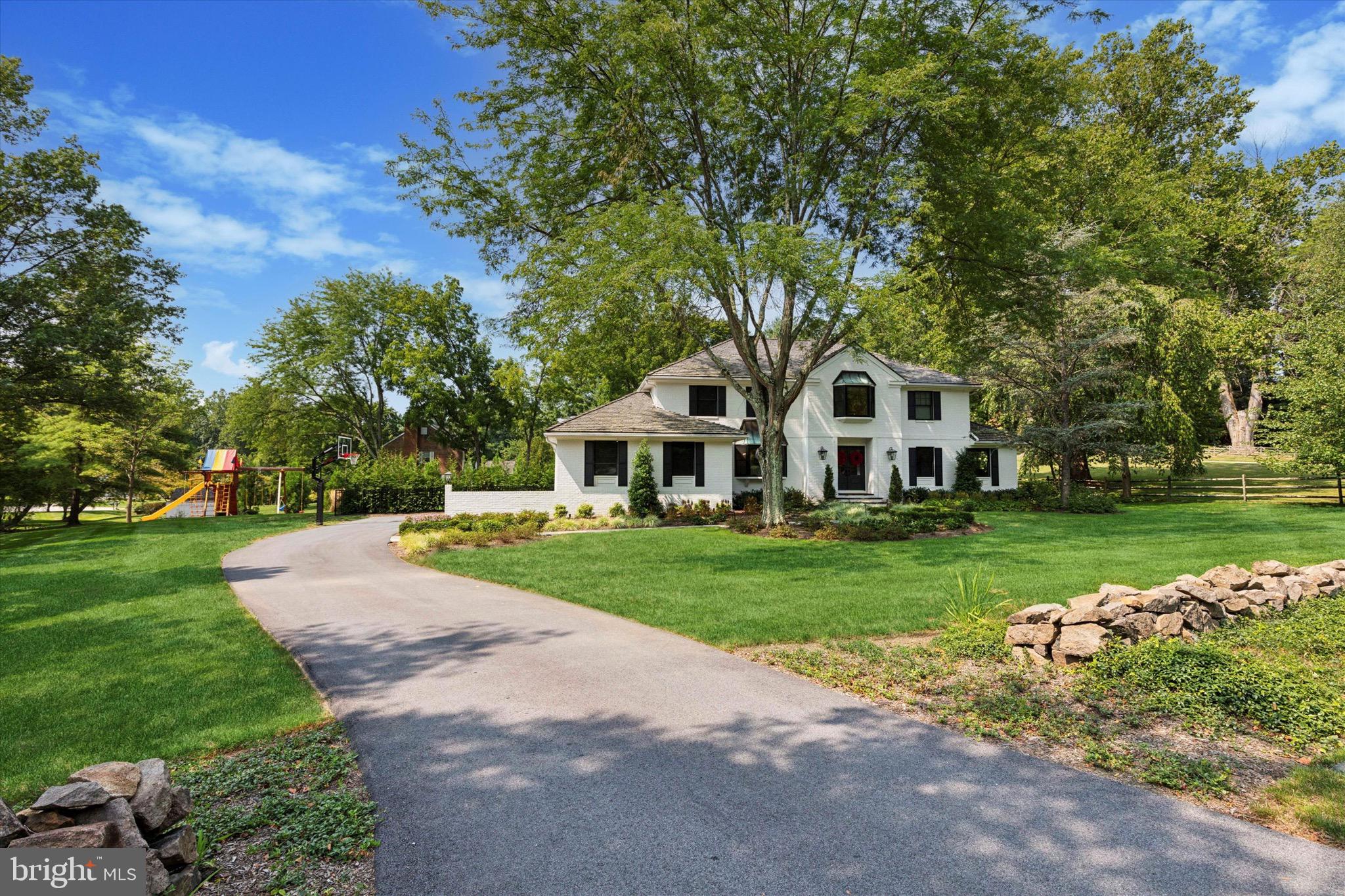 610 Dorset Road Devon, PA 19333 - Photo 1 of 54 a front view of a house with garden