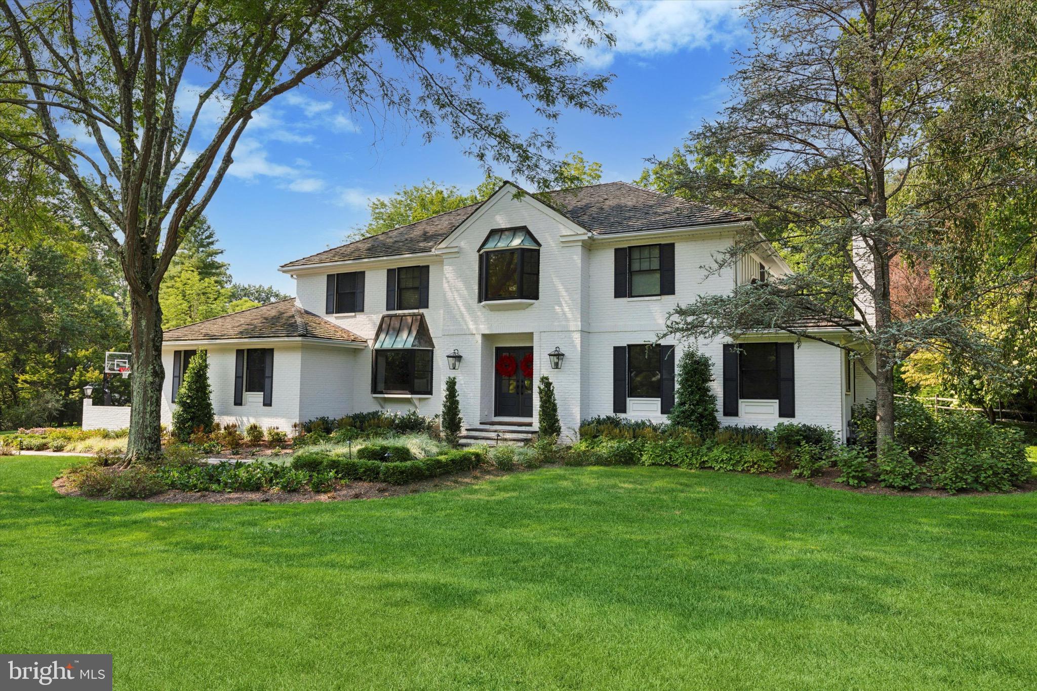 610 Dorset Road Devon, PA 19333 - Photo 2 of 54 a front view of a house with garden