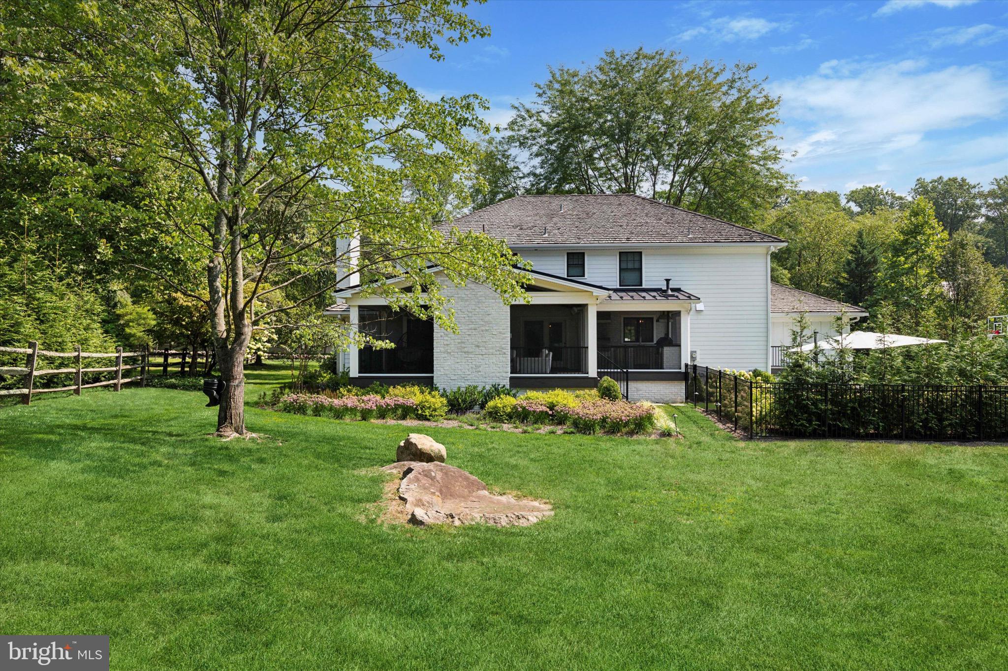 610 Dorset Road Devon, PA 19333 - Photo 9 of 54 a front view of a house with a yard and trees