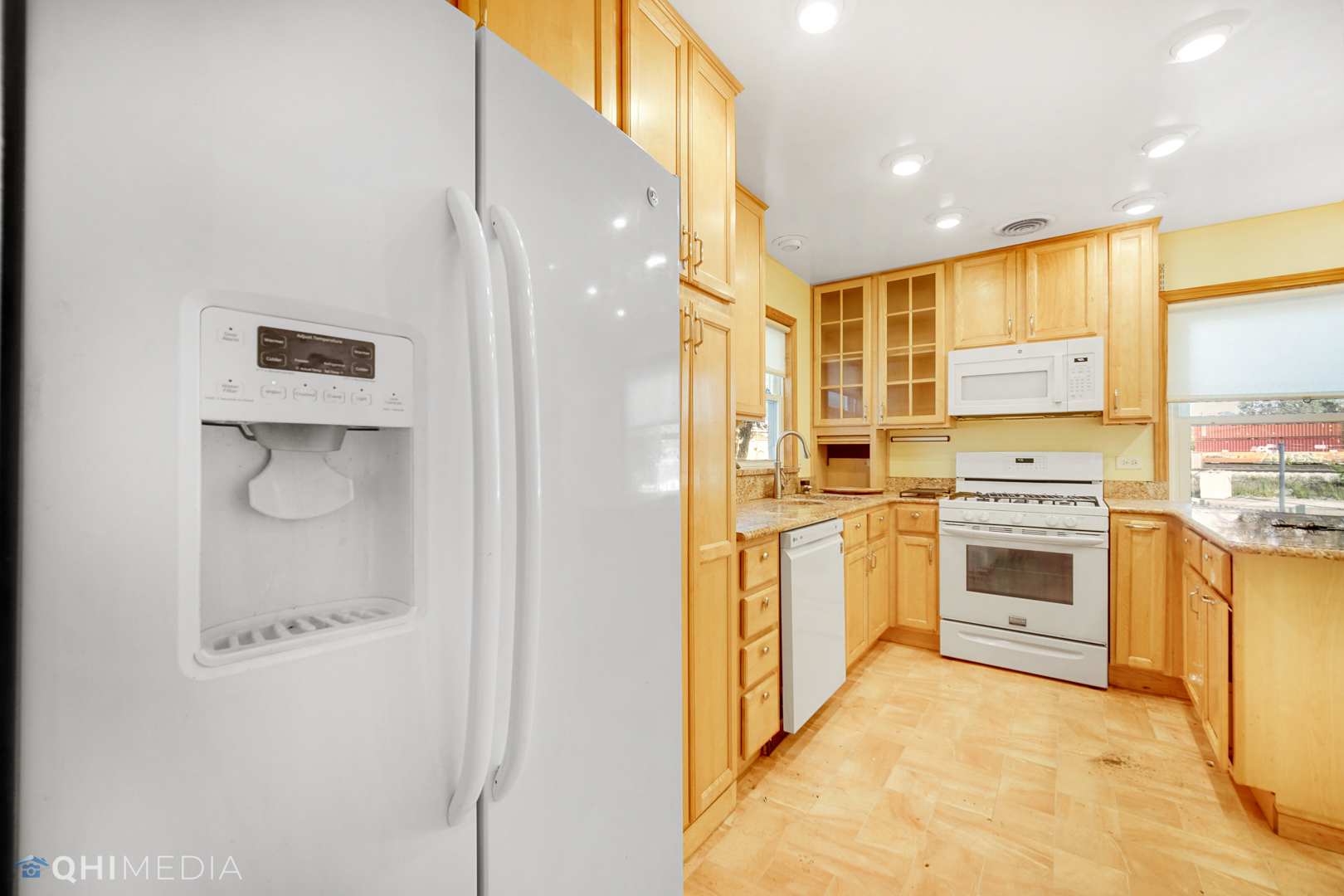 18104 Park Avenue Homewood, IL 60430 - Photo 11 of 26 a kitchen with stainless steel appliances a stove a sink and a refrigerator