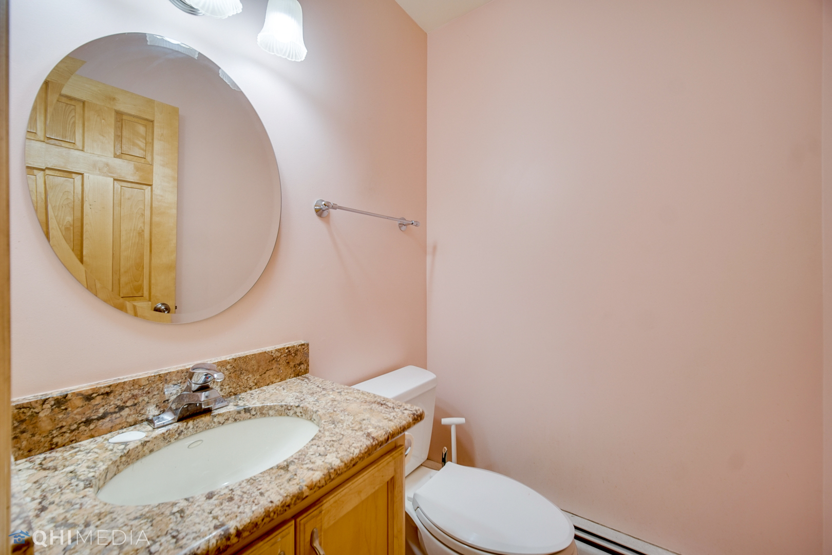 18104 Park Avenue Homewood, IL 60430 - Photo 19 of 26 a bathroom with a granite countertop toilet sink and mirror
