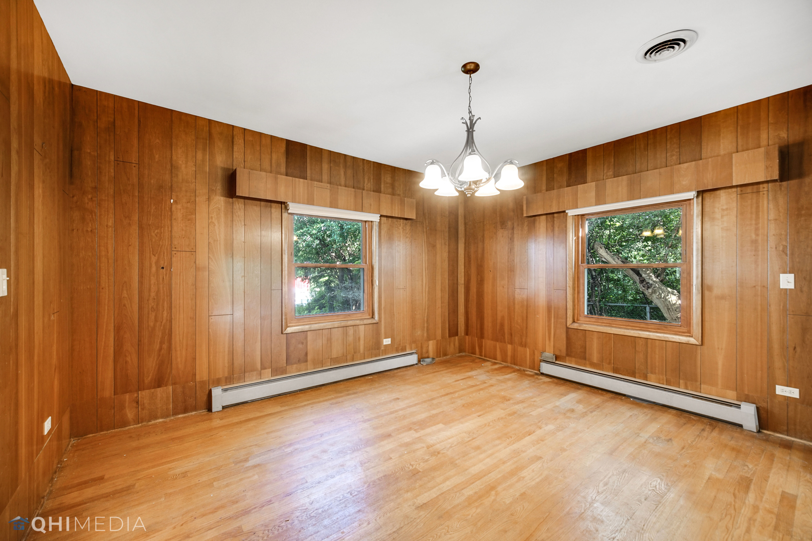 18104 Park Avenue Homewood, IL 60430 - Photo 22 of 26 a view of an empty room with wooden floor and a window