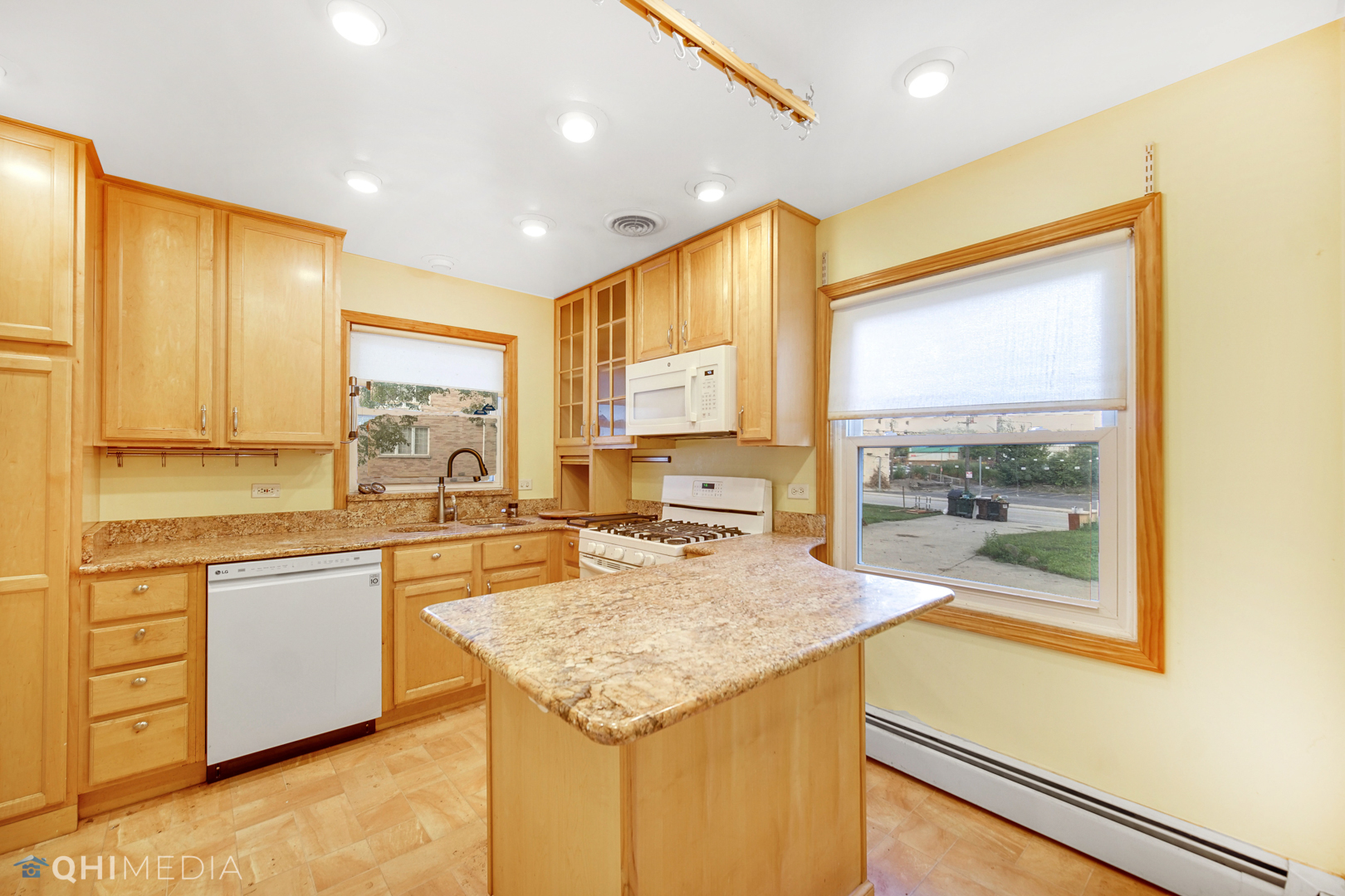 18104 Park Avenue Homewood, IL 60430 - Photo 8 of 26 a kitchen with granite countertop sink and cabinets