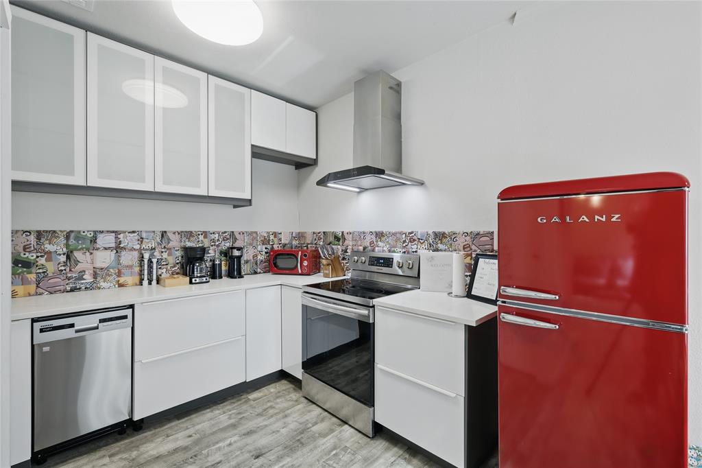 5963 Ross Avenue, Unit 202 Dallas, TX 75206 - Photo 1 of 15 a kitchen with stainless steel appliances granite countertop a sink stove and refrigerator