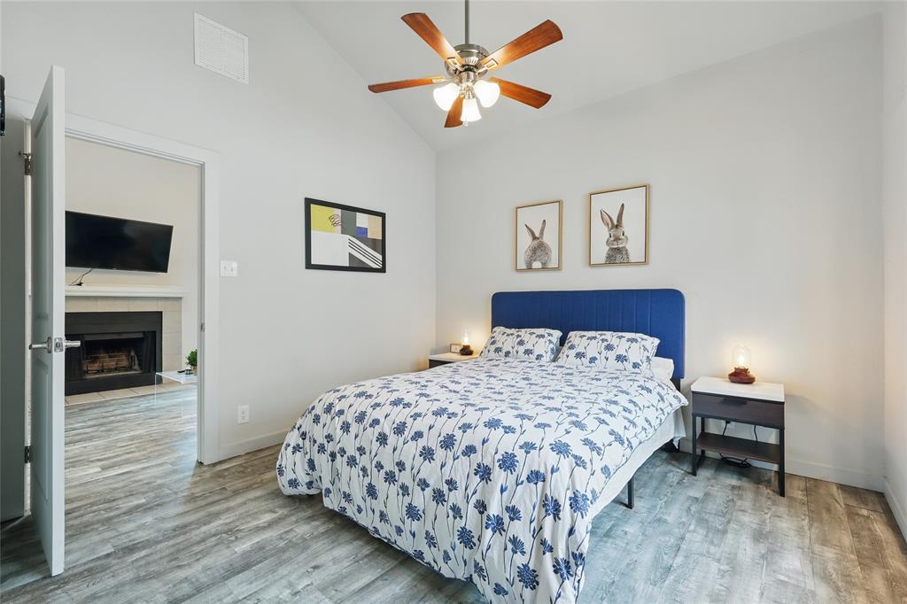 5963 Ross Avenue, Unit 202 Dallas, TX 75206 - Photo 12 of 15 a bedroom with a bed and a tv