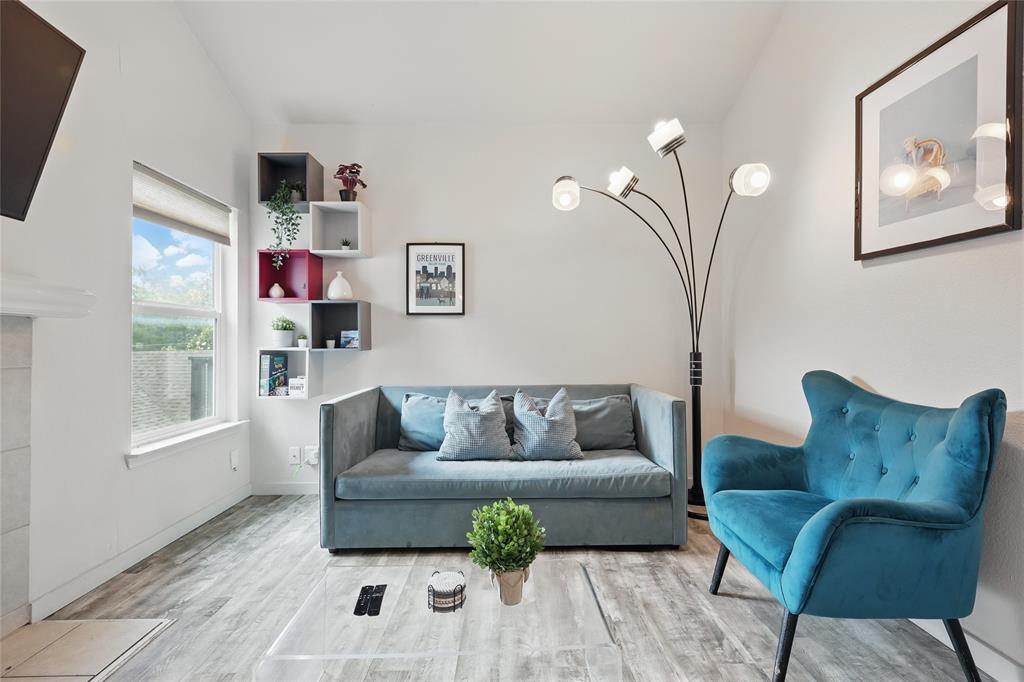 5963 Ross Avenue, Unit 202 Dallas, TX 75206 - Photo 2 of 15 a living room with furniture and a potted plant