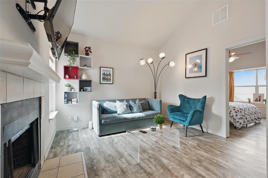 5963 Ross Avenue, Unit 202 Dallas, TX 75206 - Photo 5 of 15 a living room with furniture and a fireplace