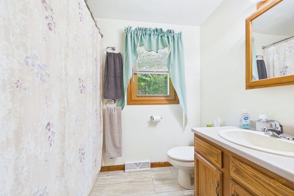 8 Cotuit Road Taunton, MA 02718 - Photo 17 of 24 a bathroom with a granite countertop sink toilet and shower