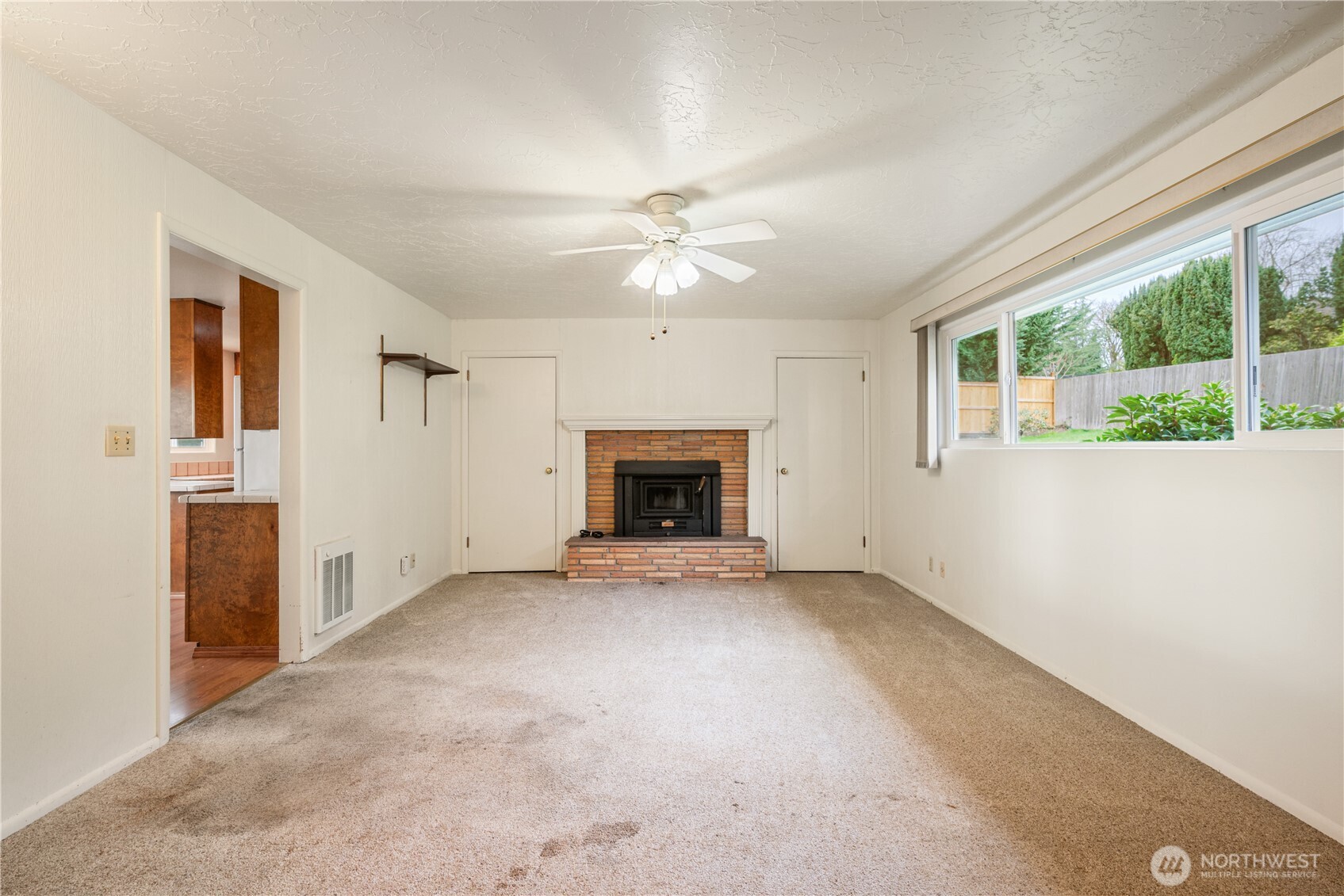 2120 Willow Place Longview, WA 98632 - Photo 13 of 28 an empty room with windows and fireplace