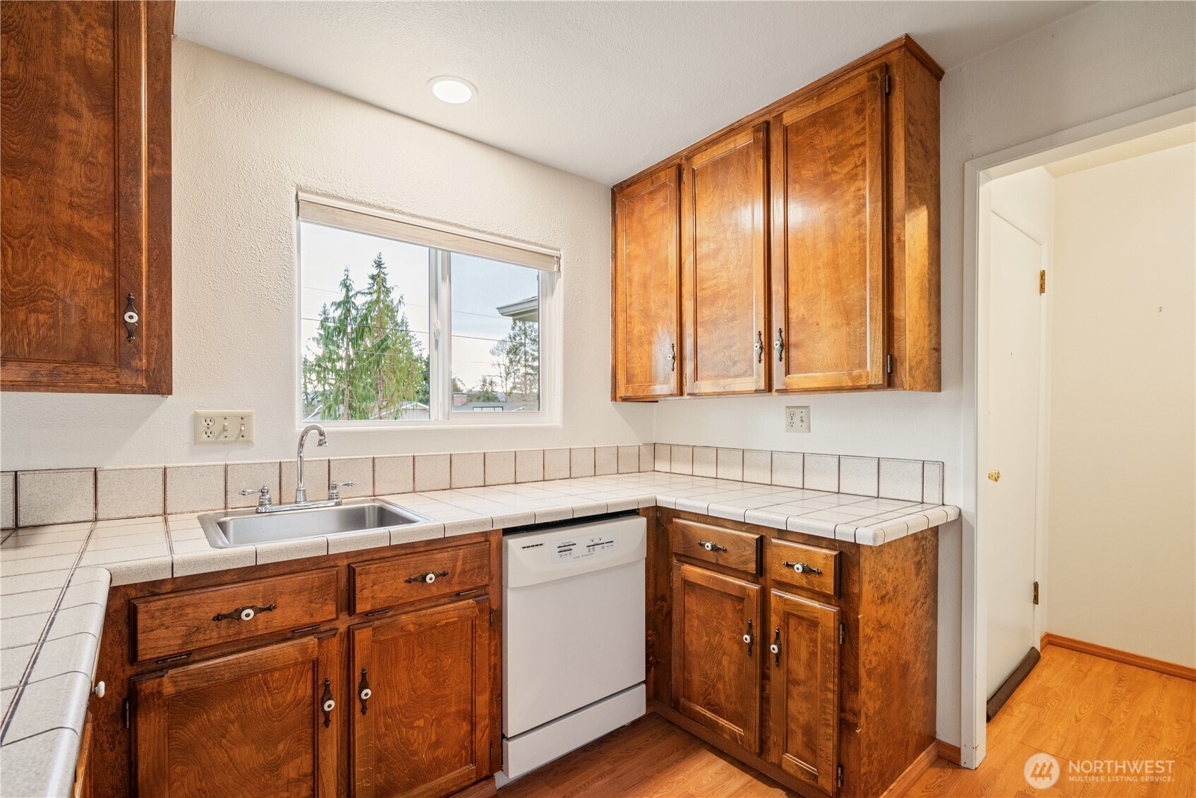 2120 Willow Place Longview, WA 98632 - Photo 4 of 28 a kitchen with stainless steel appliances granite countertop cabinets sink and window