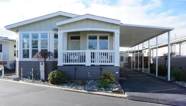 a front view of a house with garden
