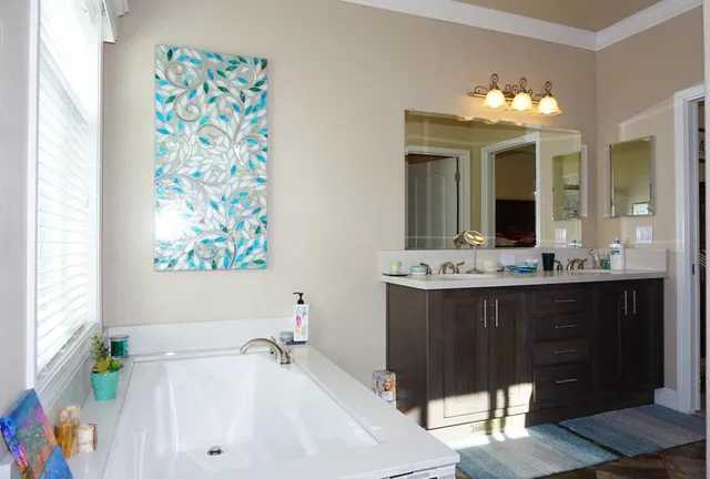 a bathroom with a sink a vanity and a mirror