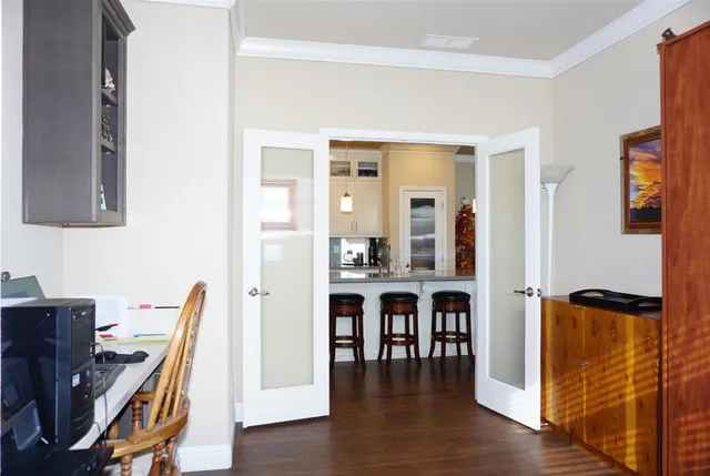 a dining room with furniture and wooden floor