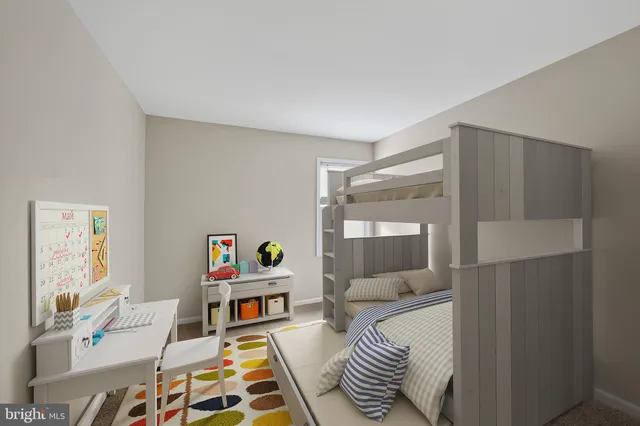 a bedroom with furniture and a wooden floor