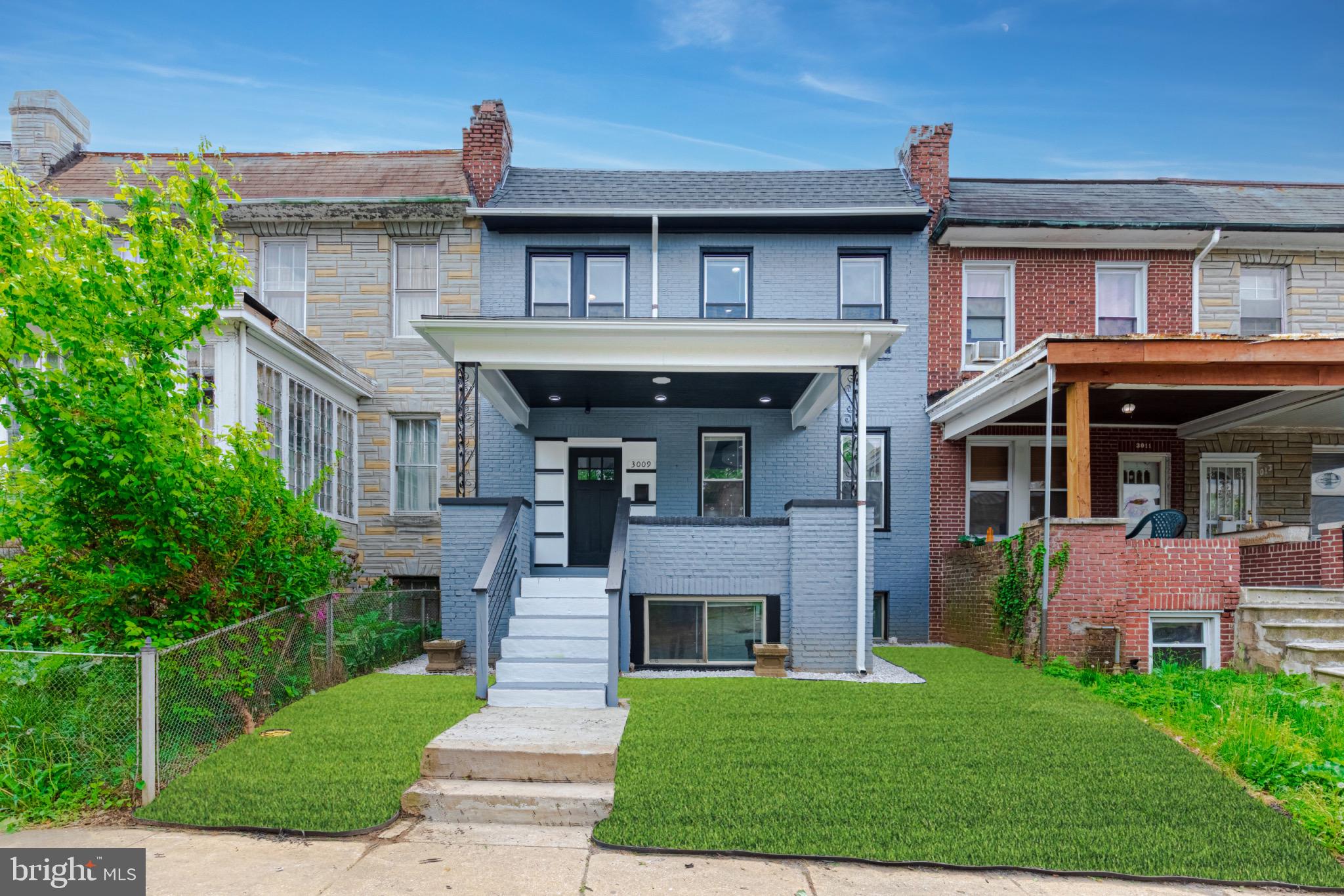 3009 Lyttleton Road Baltimore, MD 21216 - Photo 2 of 34 a front view of a house with a yard