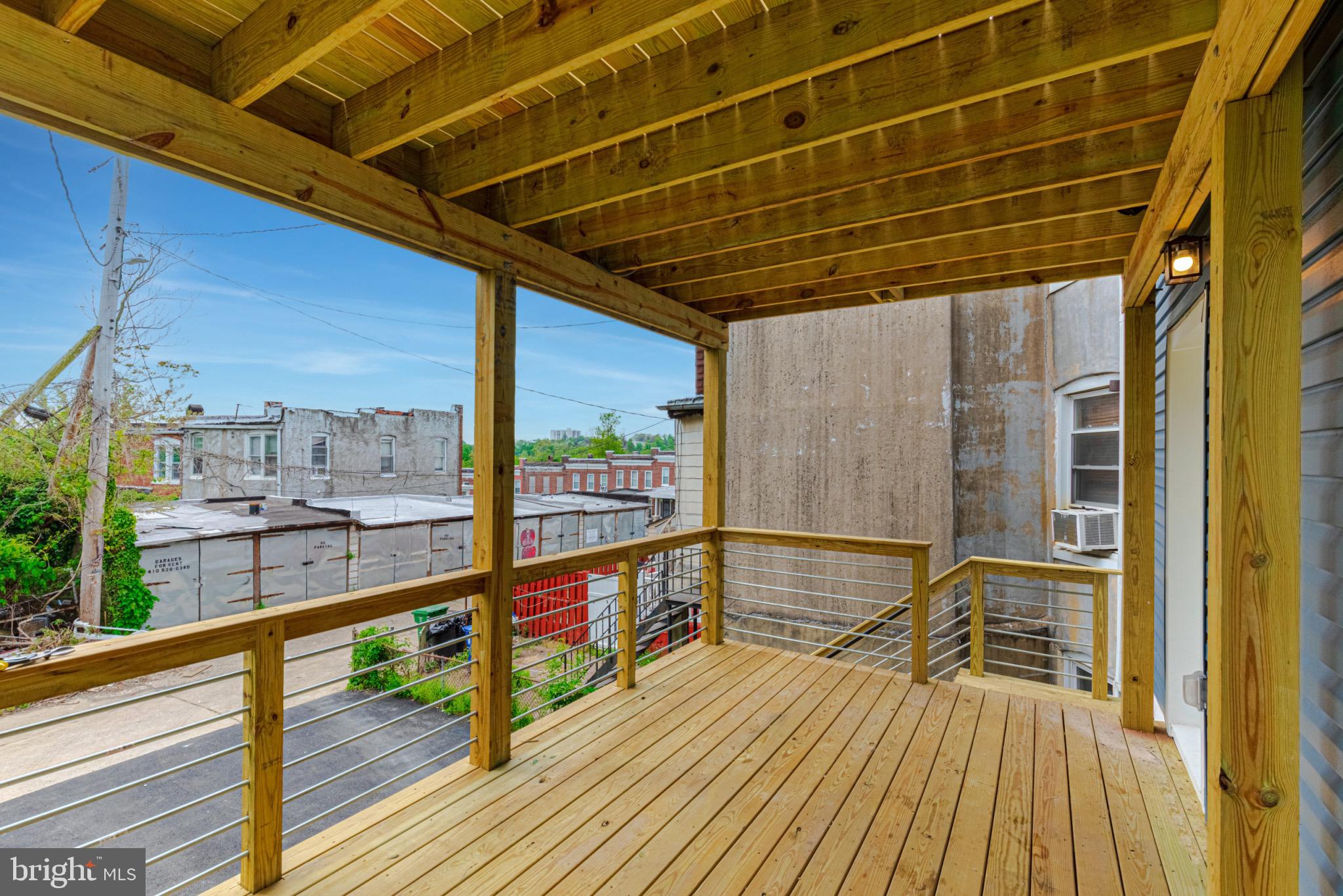 3009 Lyttleton Road Baltimore, MD 21216 - Photo 34 of 34 a view of a balcony with wooden floor