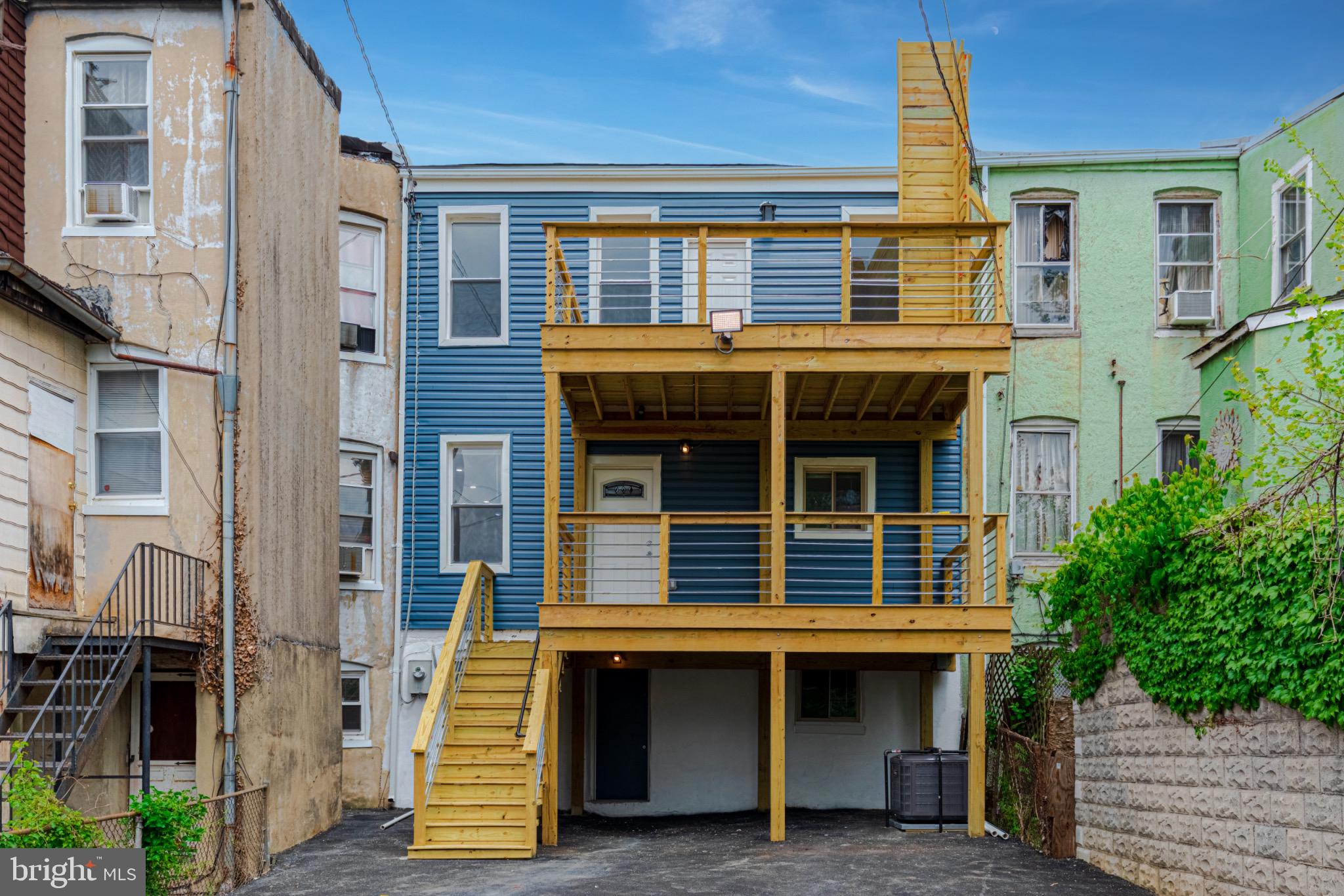 3009 Lyttleton Road Baltimore, MD 21216 - Photo 7 of 34 a front view of a house with a balcony