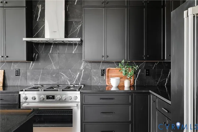 a kitchen with a sink and a stove top oven