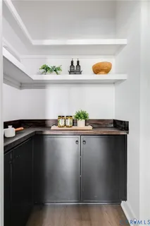 a living room with furniture and a mirror
