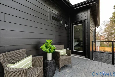 a bathroom with a glass shower door a sink and a mirror