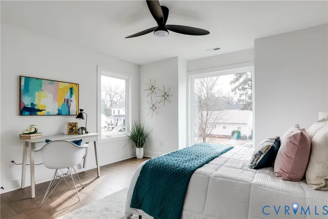 a bedroom with bed and a night stand