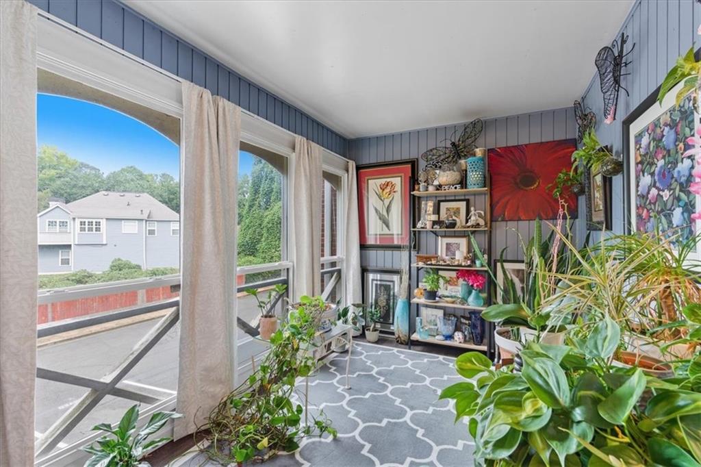 1166 Booth Road Southwest, Unit 906 Marietta, GA 30008 - Photo 21 of 27 a view of entryway with a flower garden