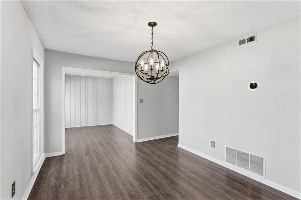 1166 Booth Road Southwest, Unit 906 Marietta, GA 30008 - Photo 8 of 27 a view of a hallway with wooden floor