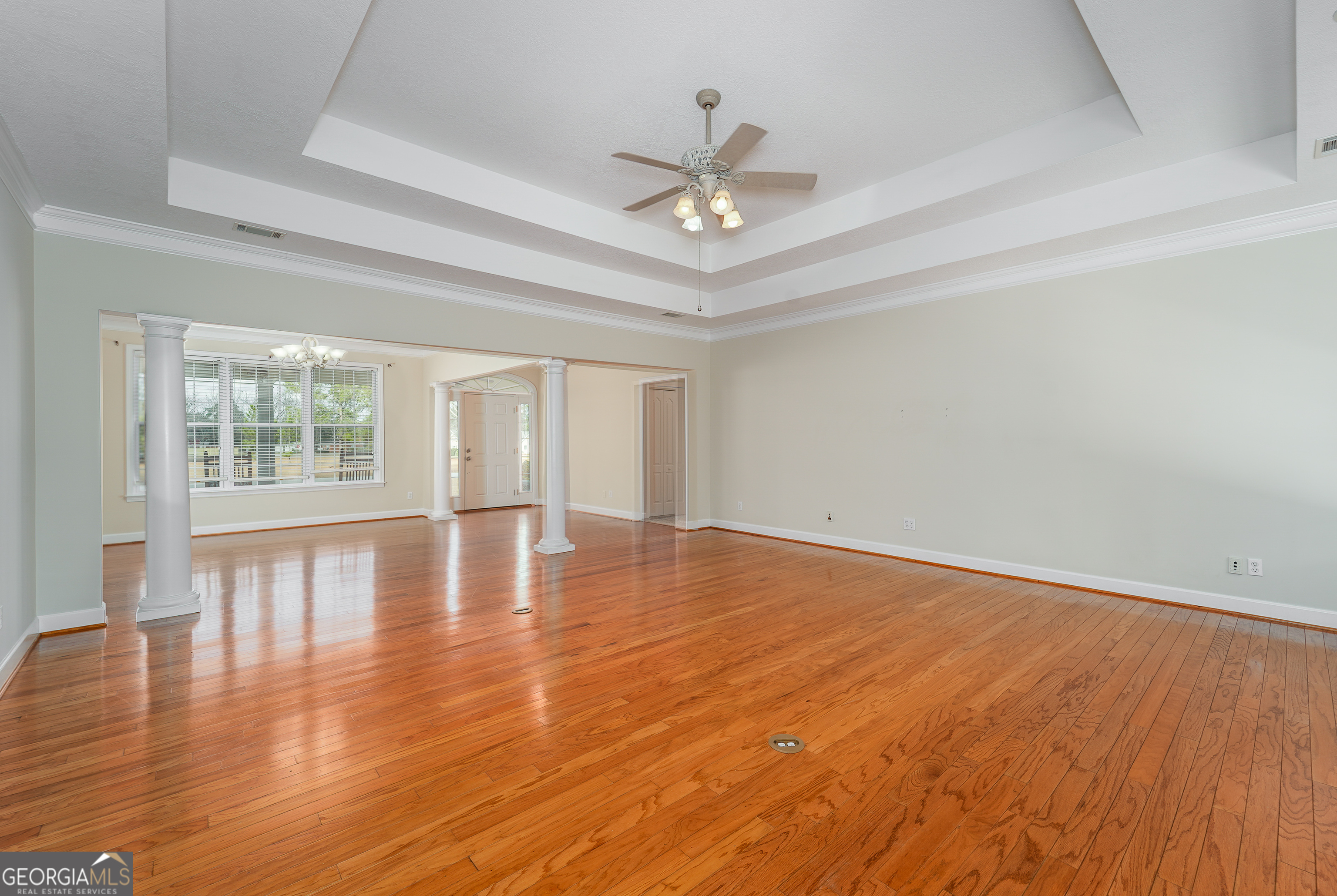4023 Redstone Circle Blackshear, GA 31516 - Photo 11 of 27 a view of empty room with wooden floor and fan