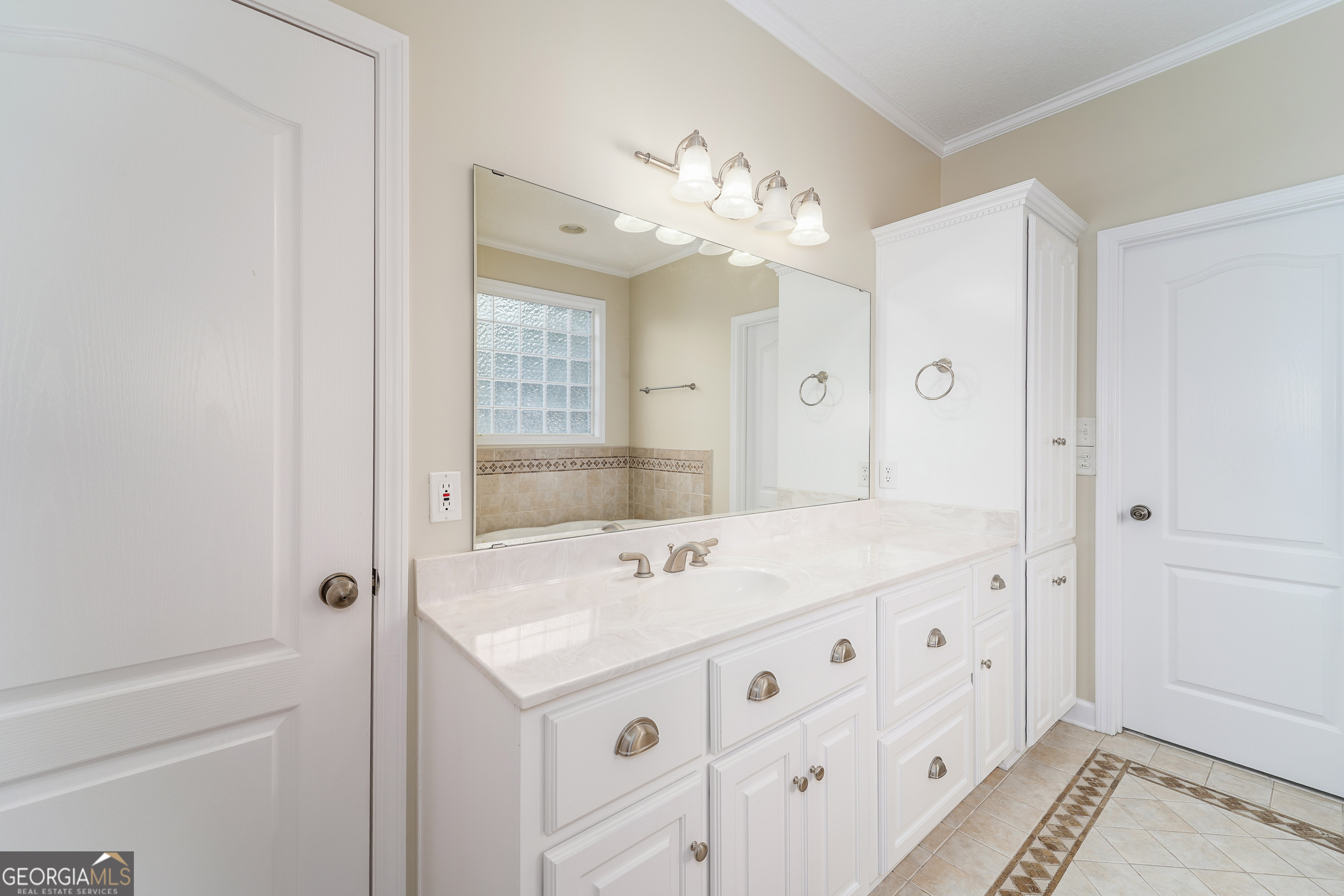 4023 Redstone Circle Blackshear, GA 31516 - Photo 16 of 27 a bathroom with a sink a vanity and a mirror